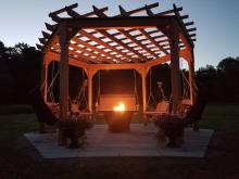 wood swing gola with fire pit